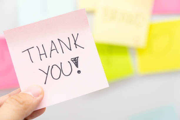 istock Hand holding a pink sticky note with THANK YOU text. Copy space. 2175548953