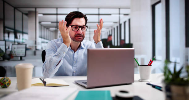 istock Upset Worried Man Using Laptop 2175556722