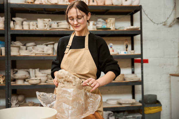 istock Female potter at work in ceramics studio 2175557584