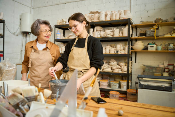 istock Female potter prepares clay for work 2175557646