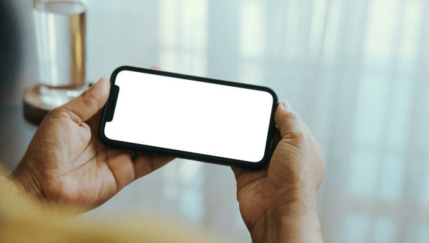 istock Woman Holding Mobile Phone with Blank White Screen 2175559352