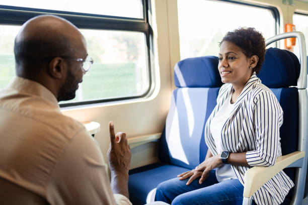 istock Latin couple enjoying their time together while riding in a train 2175559479
