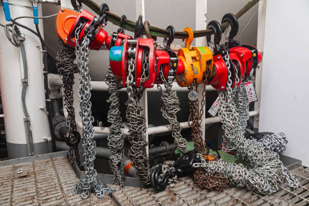 istock Chain hoists for lifting weights in a workshop close-up. 2175560143