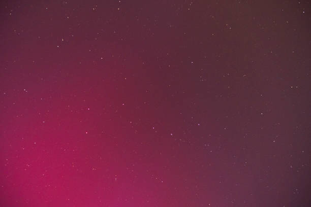 Strange eerie pink northern lights aurora unusual sky in the Midwest, Indiana, USA