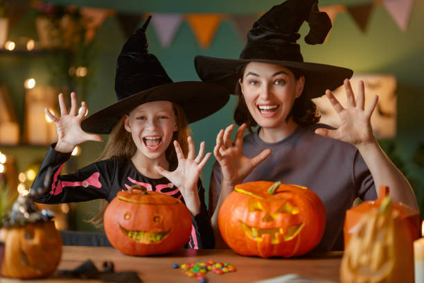 istock Happy family preparing for Halloween. 2175569775