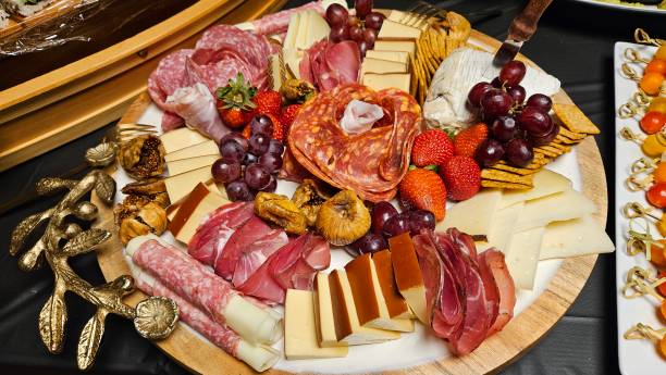 istock Cheese platter and bite size foods including sushi bar decorated on a table for a party 2175569934