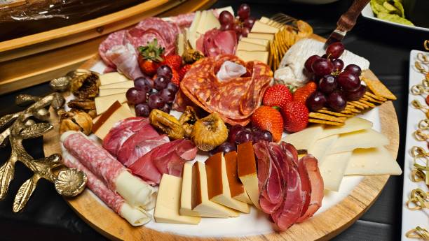 istock Cheese platter and bite size foods including sushi bar decorated on a table for a party 2175569968