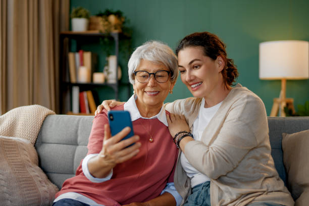 istock Young and senior women are using smartphone 2175570835