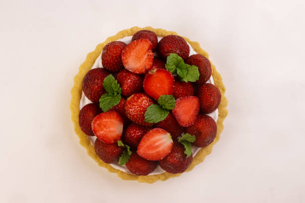 Strawberry Tart with Cream, Garnish with Mint Leaf.