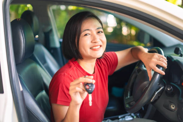 istock Woman happily received used car 2175572232