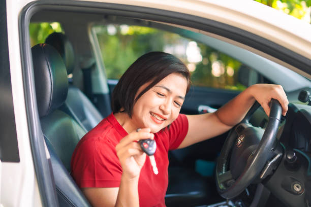 istock Woman happily received used car 2175572236