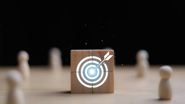 istock White dartboard and white arrow with human for customer focus target group and customer relation management concept. 2175574100