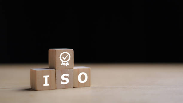 istock ISO quality control certification concept. wooden cubes with the abbreviation ISO with a check mark. 2175574155