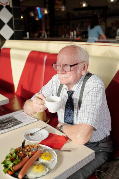 istock Enjoying Breakfast at Diner with Coffee and Newspaper 2175576222