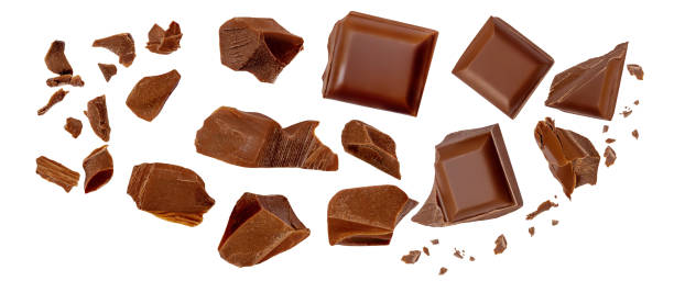 istock Chocolate explosion isolated on white. Flying milk Chocolate pieces Top view. Flat lay. Chocolate levitation 2175576483