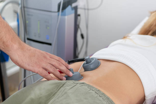 istock Physical therapist using vacuum therapy on the lower back helps relieve muscle tension, improve blood circulation, reduce pain, and enhance recovery from injury or chronic back issues 2175577641