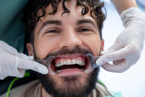 istock Stomatologist doing check of patient's teeth with professional expertise while managing dental tools 2175578703