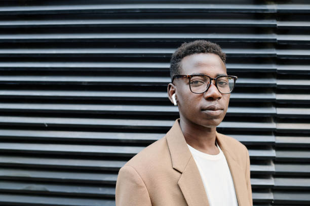 istock Young Man In Eyeglasses Standing Outdoors 2175579028