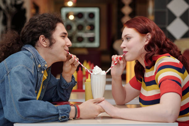 istock Enjoying Milkshake Together in Retro Diner Setting 2175579271