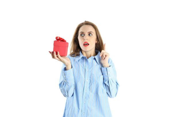 istock Attractive woman holds gift box, isolated on white background 2175579417
