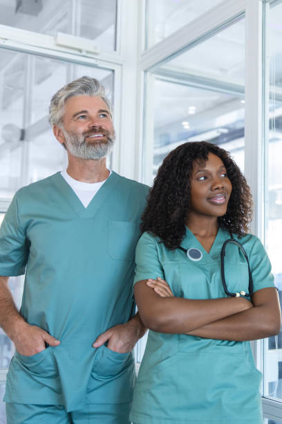 istock Two doctors looking contented and confident while standing in the hospital corridor 2175579717