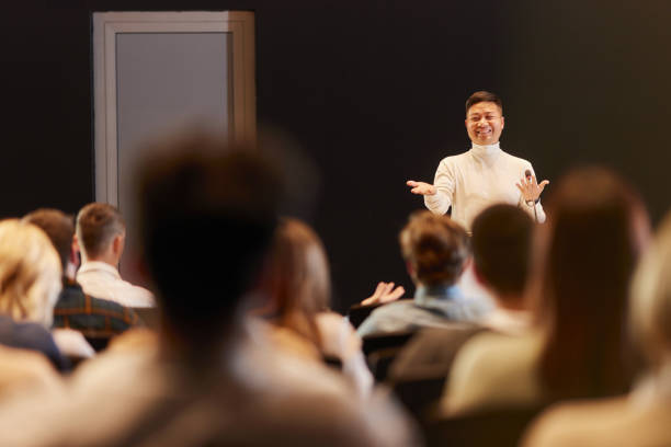 istock Happy Chinese public speaker on a seminar in convention center. 2175580090