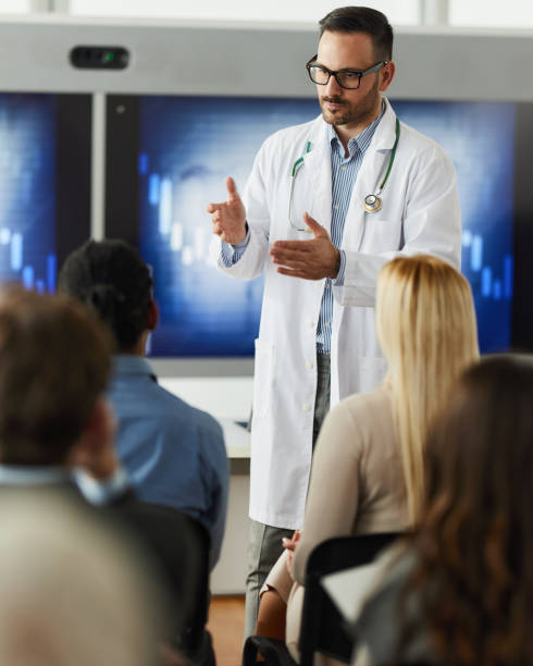 istock Male doctor leading a presentation in board room. 2175580617