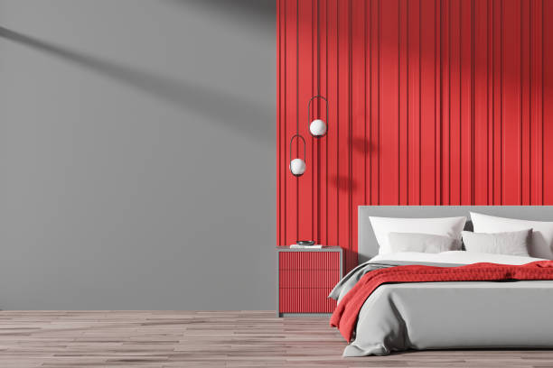 istock Modern bedroom interior with red accent wall and cozy bed. 3D Rendering 2175581316