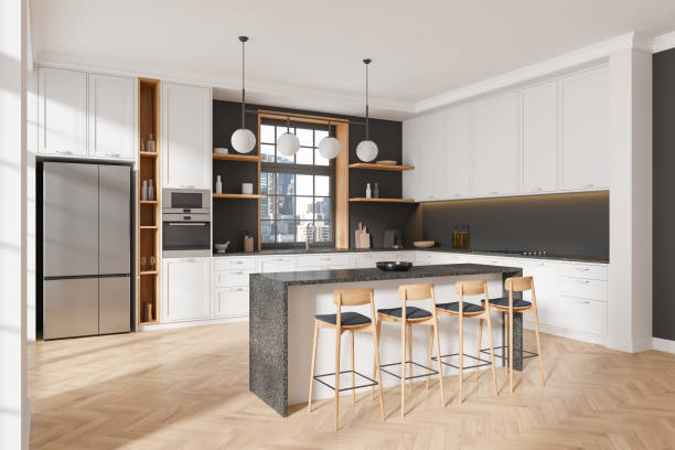 istock Modern home kitchen interior with island and cooking cabinet, panoramic window 2175581384