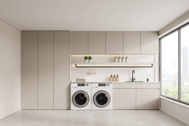 istock Modern laundry room with appliances and minimalist cabinets. 3D Rendering 2175581503