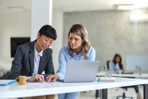 istock Diverse businesswomen working on documents in the office. 2175581745