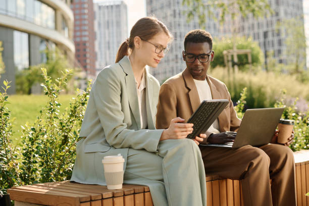 istock Two Young Managers Coworking Outdoors 2175582116