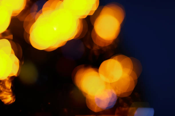 istock blurred golden  lights bokeh on dark background 2175586616