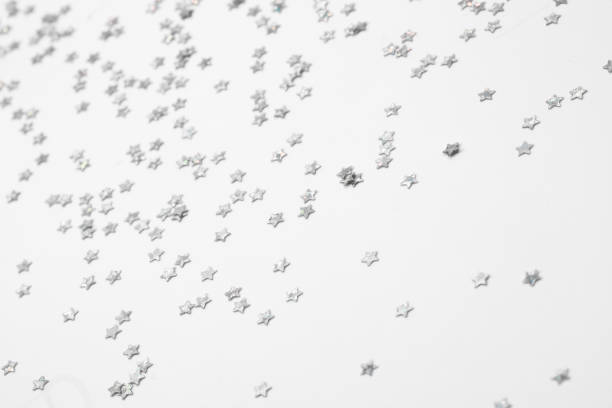 sparkles silver stars on white background with text place