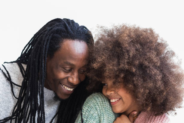 istock Delighted black man cuddling with daughter 2175590229