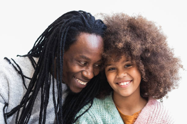 istock Delighted black man cuddling with daughter 2175590231