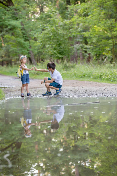 istock Children, playing in the forest on a summer day 2175590270