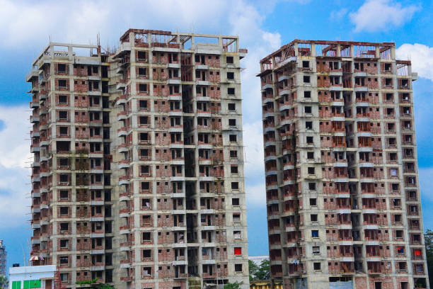istock Under construction residential twin tower buildings with concrete block or red bricks structure 2175590539