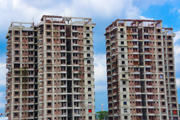 Large multistorey building under construction with beautiful blue sky background