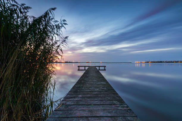 istock Enjoying the blue hour on a pier between the reeds near Den Oever. 2175590743