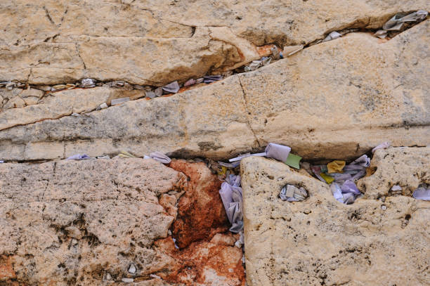 istock Tiny prayer notes inserted into the cracks and crevices of the Western Wall holy site in Jerusalem, Israel. 2175593470