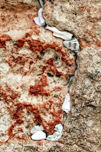 istock Tiny prayer notes inserted into the cracks and crevices of the Western Wall holy site in Jerusalem, Israel. 2175593481
