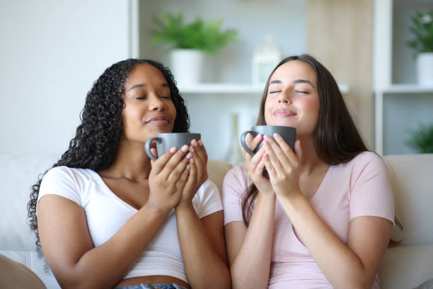istock Interracial roommates smelling coffee or tea at home 2175594965