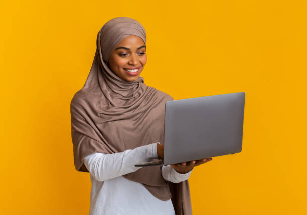 istock Afro Muslim Woman Freelancer In Hijab Using Laptop, Working Online 2175596678
