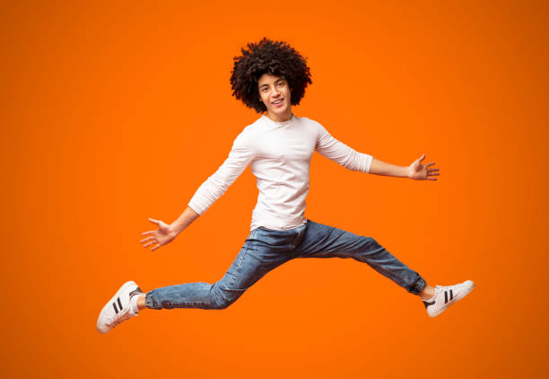 istock Funny young black man walking on air 2175597229