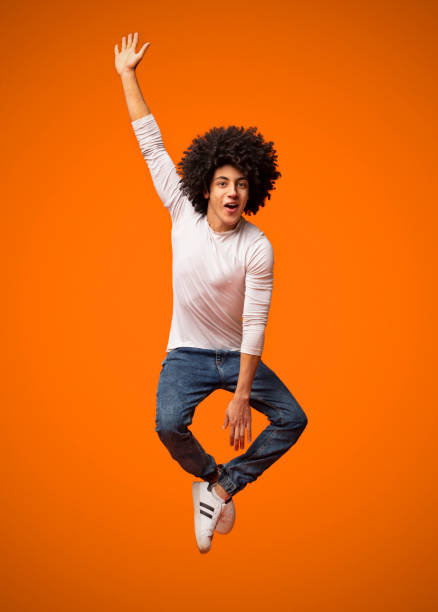 istock Funny young black man jumping on the air 2175597282