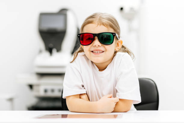 istock A modern approach to orthoptic therapy for comfortable vision treatment in children. A cheerful girl wearing vision stimulation glasses highlights the importance of an engaging restoration process. 2175597744