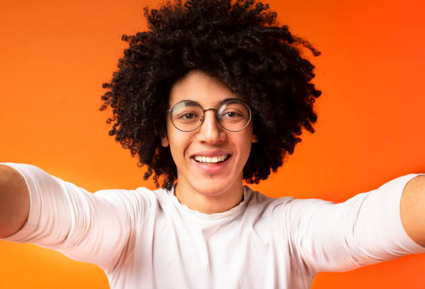 istock Handsome young black man holding camera and making selfie 2175597888