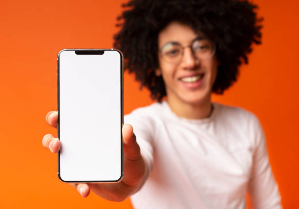 istock African-american millennial man showing blank cellphone screen 2175597895