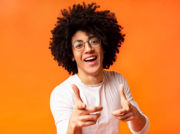istock Cheerful man in spectacle indicating happily at you 2175597911